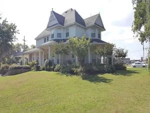 Victorian home with multi-gable roof featuring new asphalt shingles and dormers